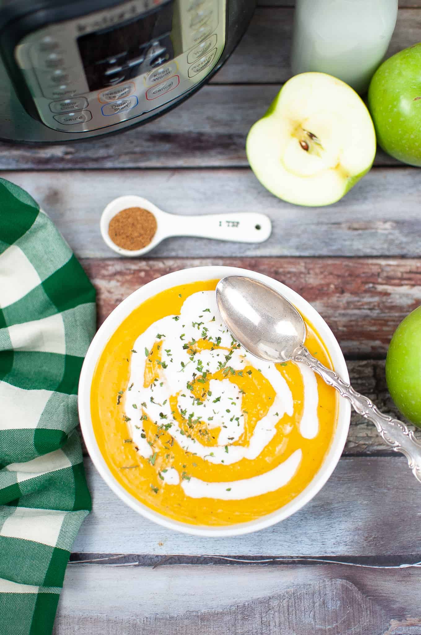 Overhead view of butternut squash with coconut milk drizzled on it.