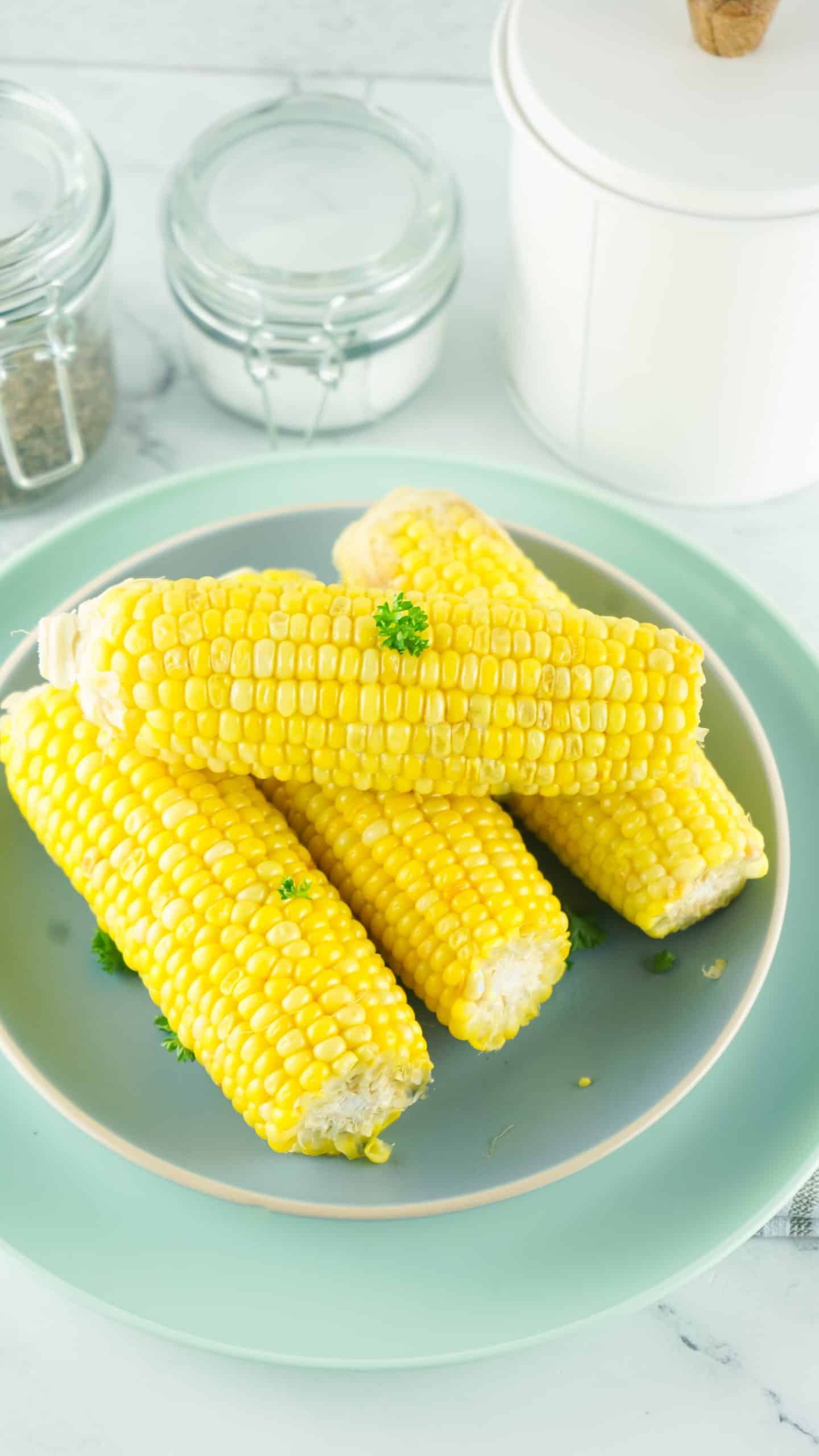 Overhead view of cooked corn on a plate.