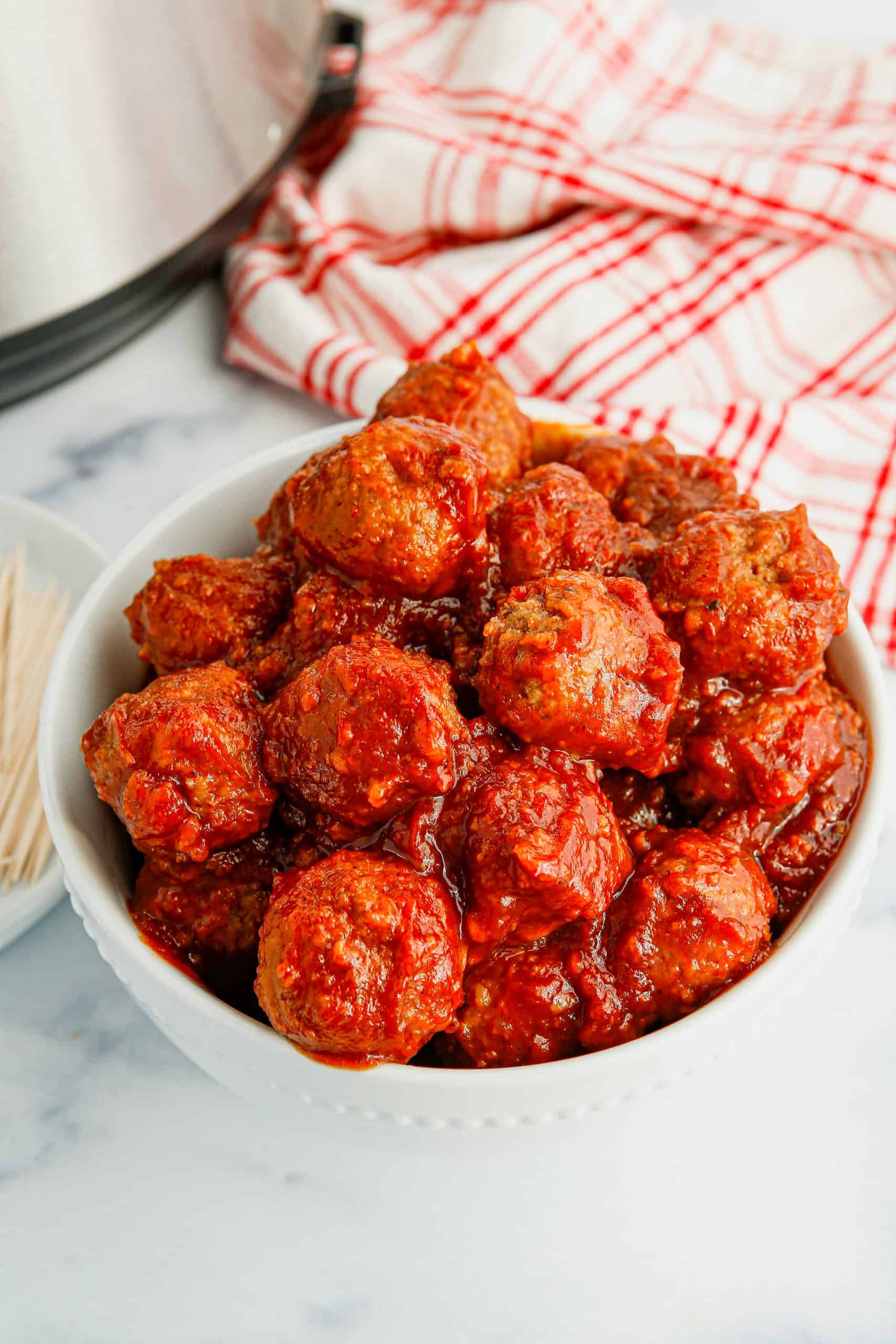 Instant Pot Cranberry Meatballs in a white bowl.