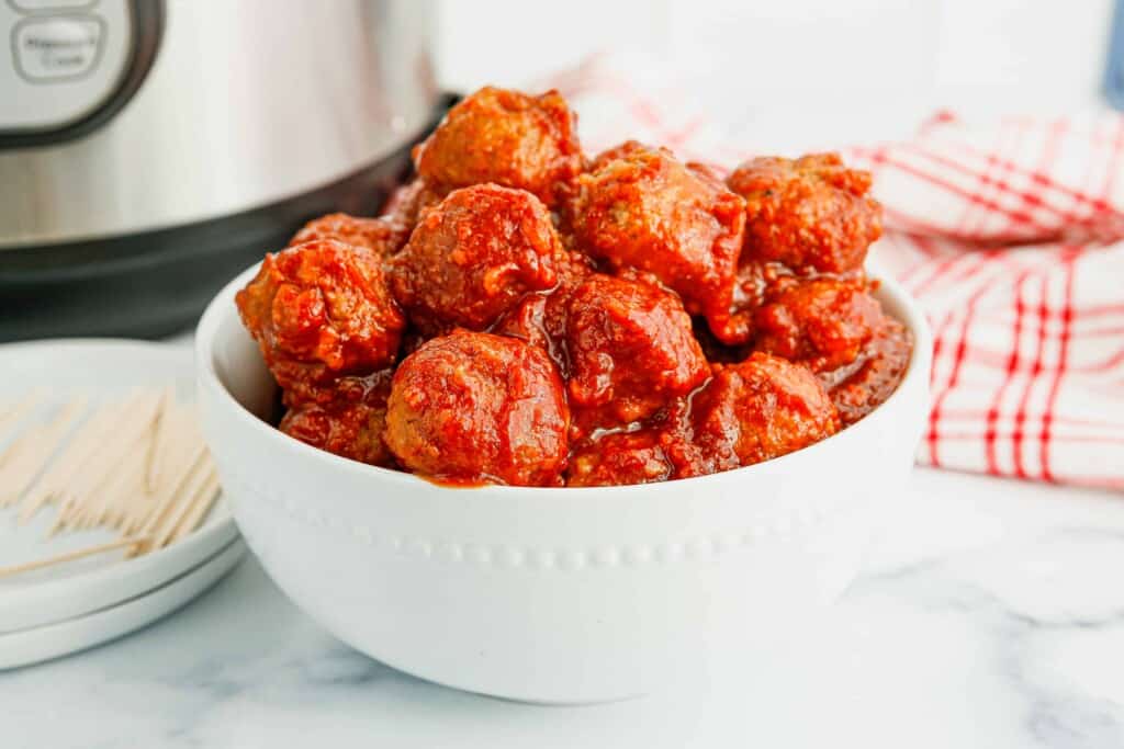 Cranberry Meatballs in a white bowl.