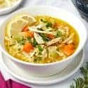 Bowl of lemon chicken orzo soup.