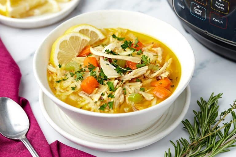 Bowl of lemon chicken orzo soup.