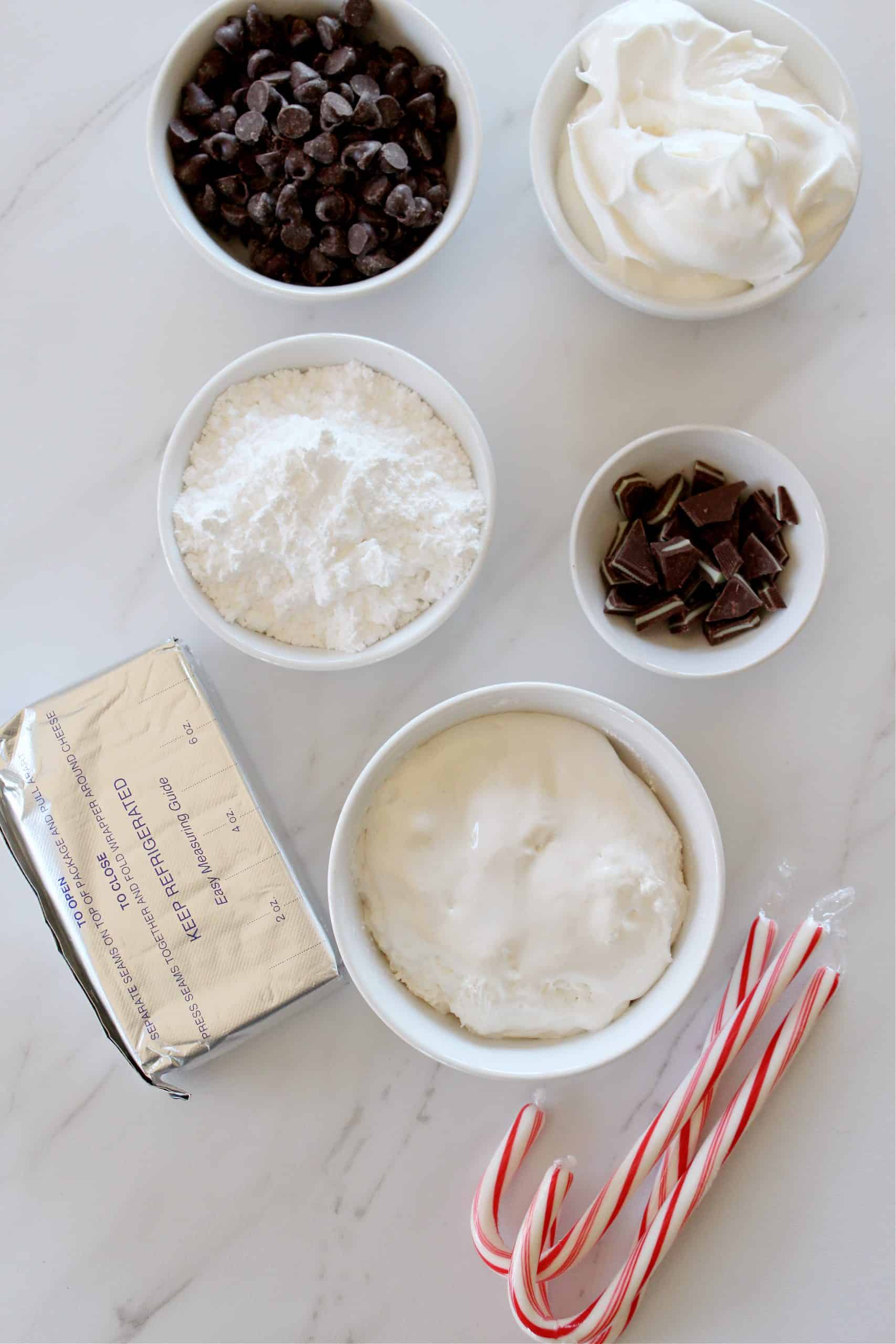 Overhead view of peppermint bark cheesecake dip ingredients.