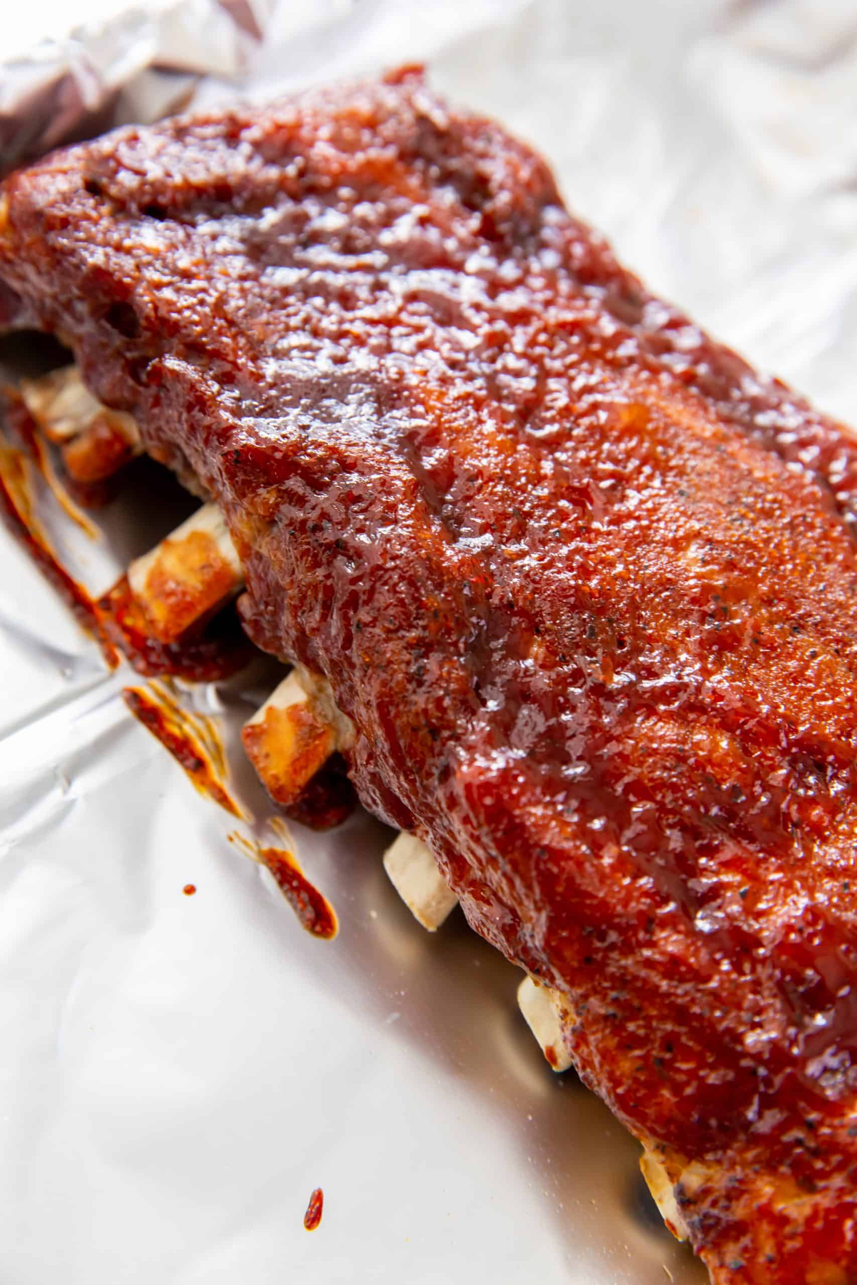 Broiled Baby Back Ribs on aluminum foil lined pan.