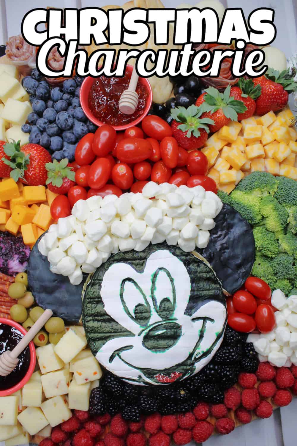 Christmas Charcuterie Board Pin with Mickey Mouse Brie in the center.