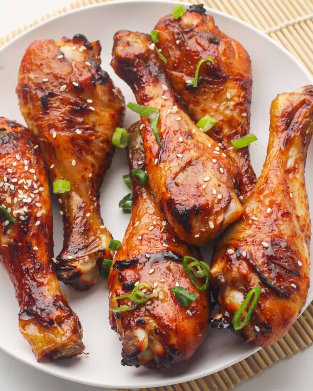 Overhead view of glazed drumsticks with honey & soy sauce.