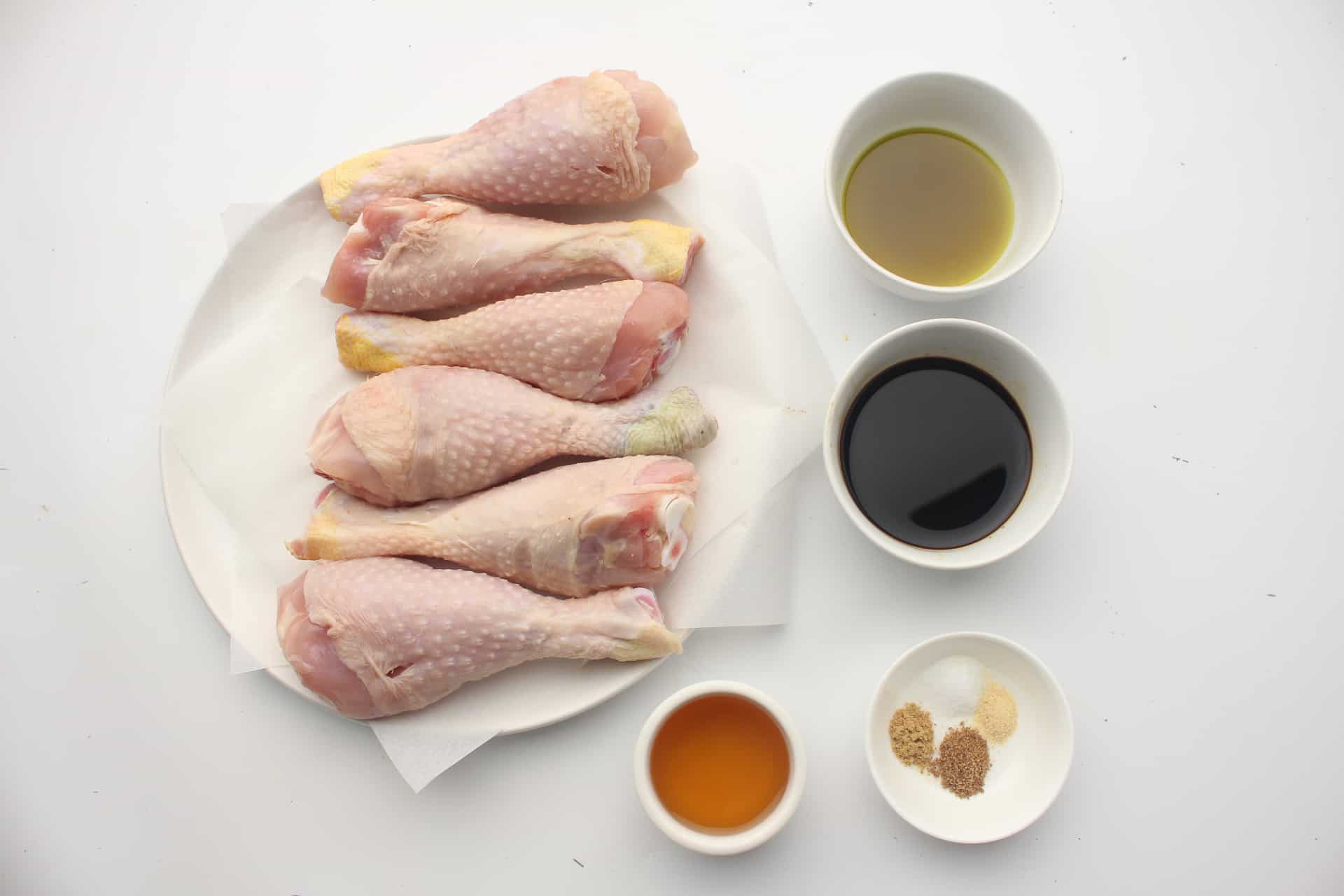 Overhead photo of ingredients for the chicken drumsticks with honey-soy glaze.