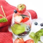 angled over head view of strawberry blueberry mint water.