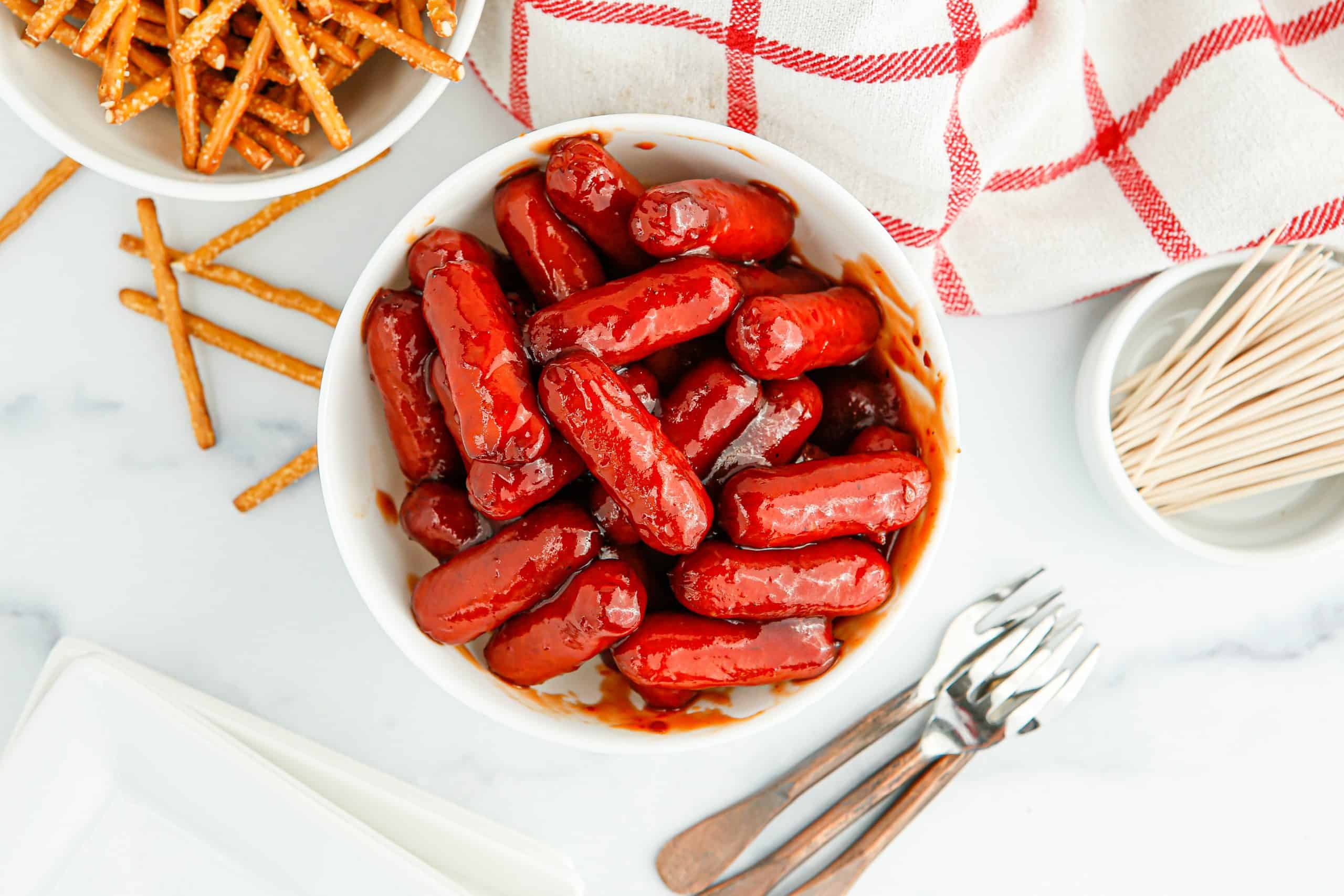 Overhead view of air fryer little smokies with BBQ sauce.