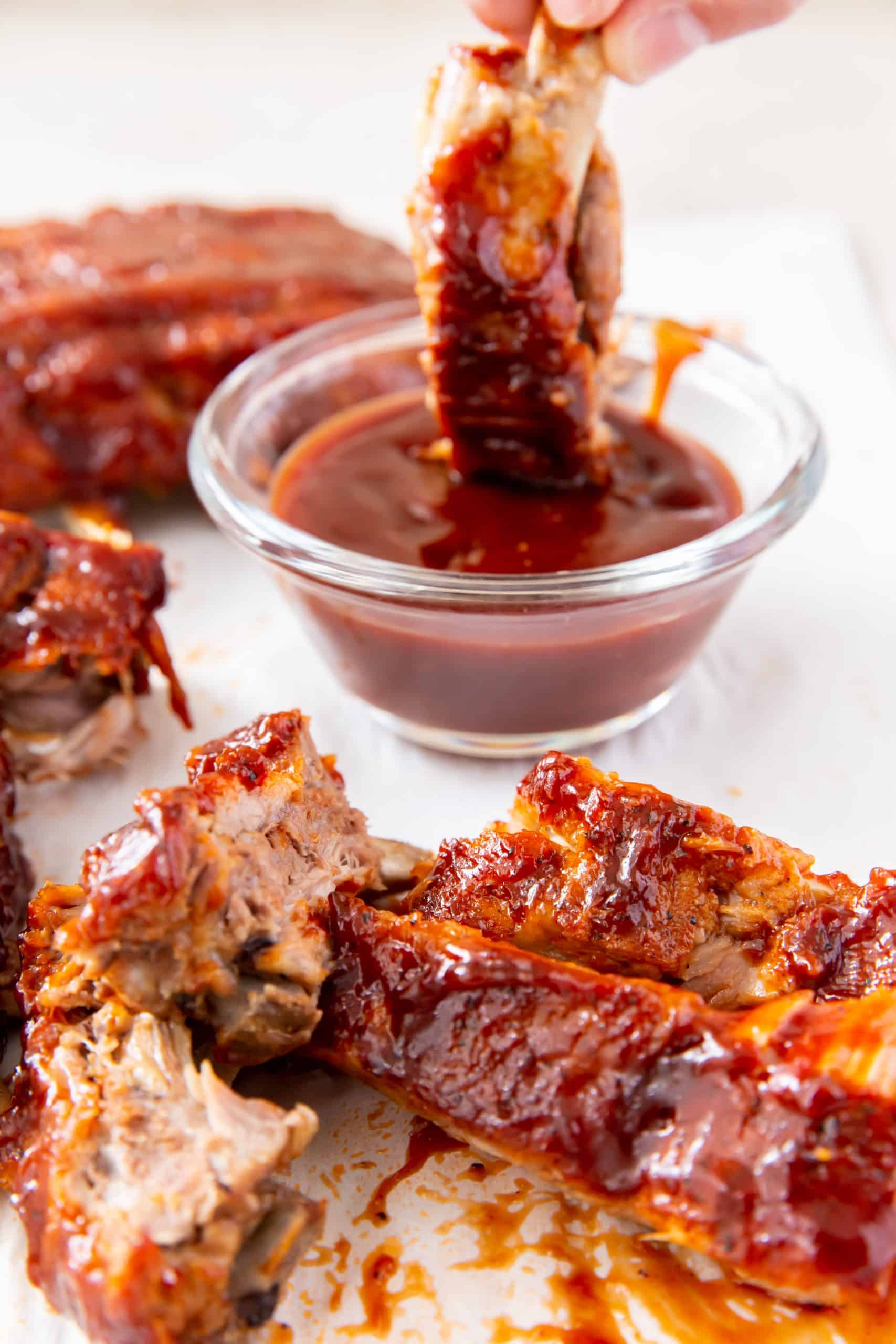Ribs dipped in sauce.