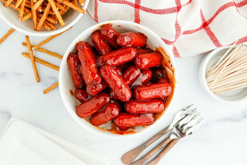overheade view of bbq little smokies in a white bowl