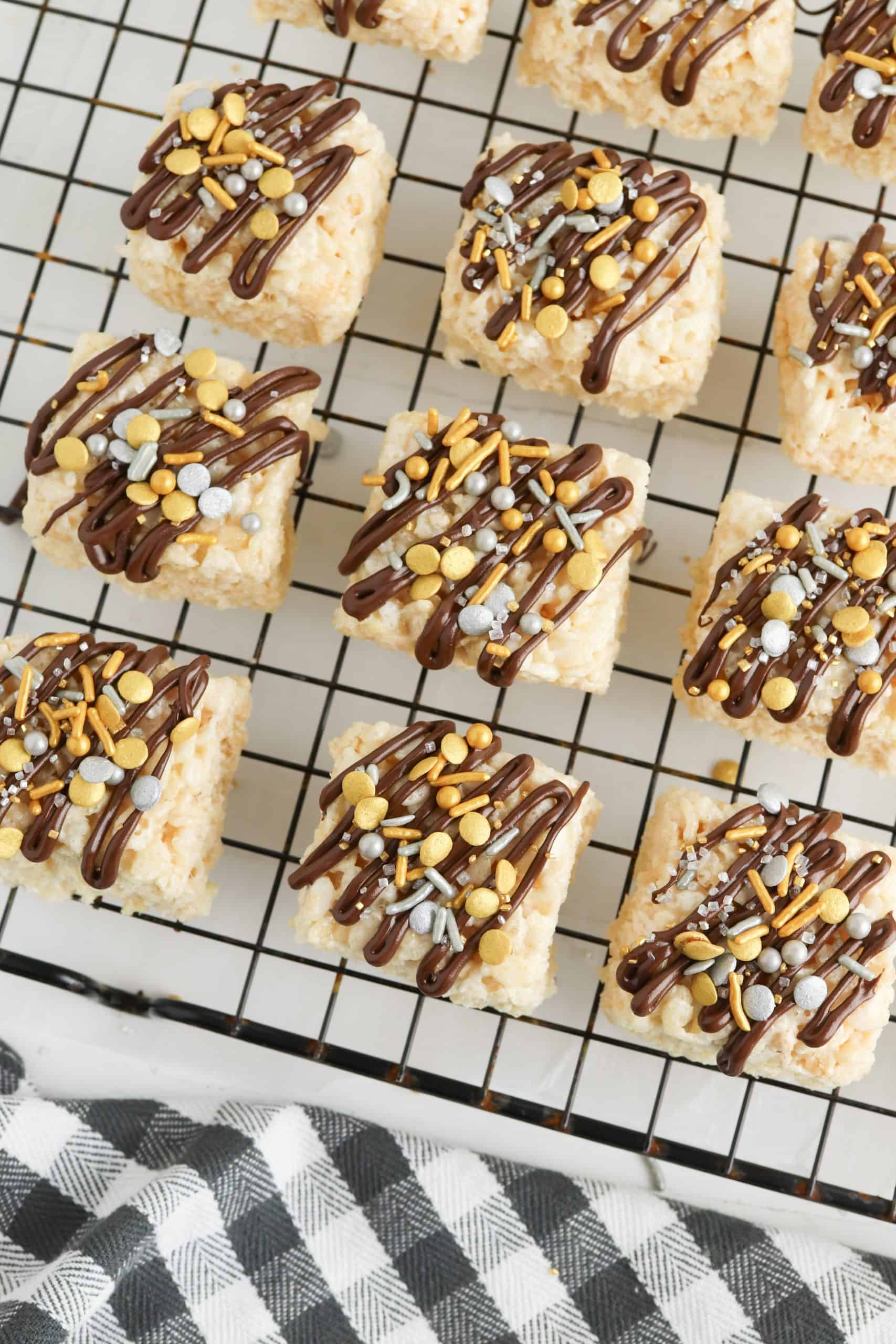 Overhead view of rice cereal snacks on a baking rack.