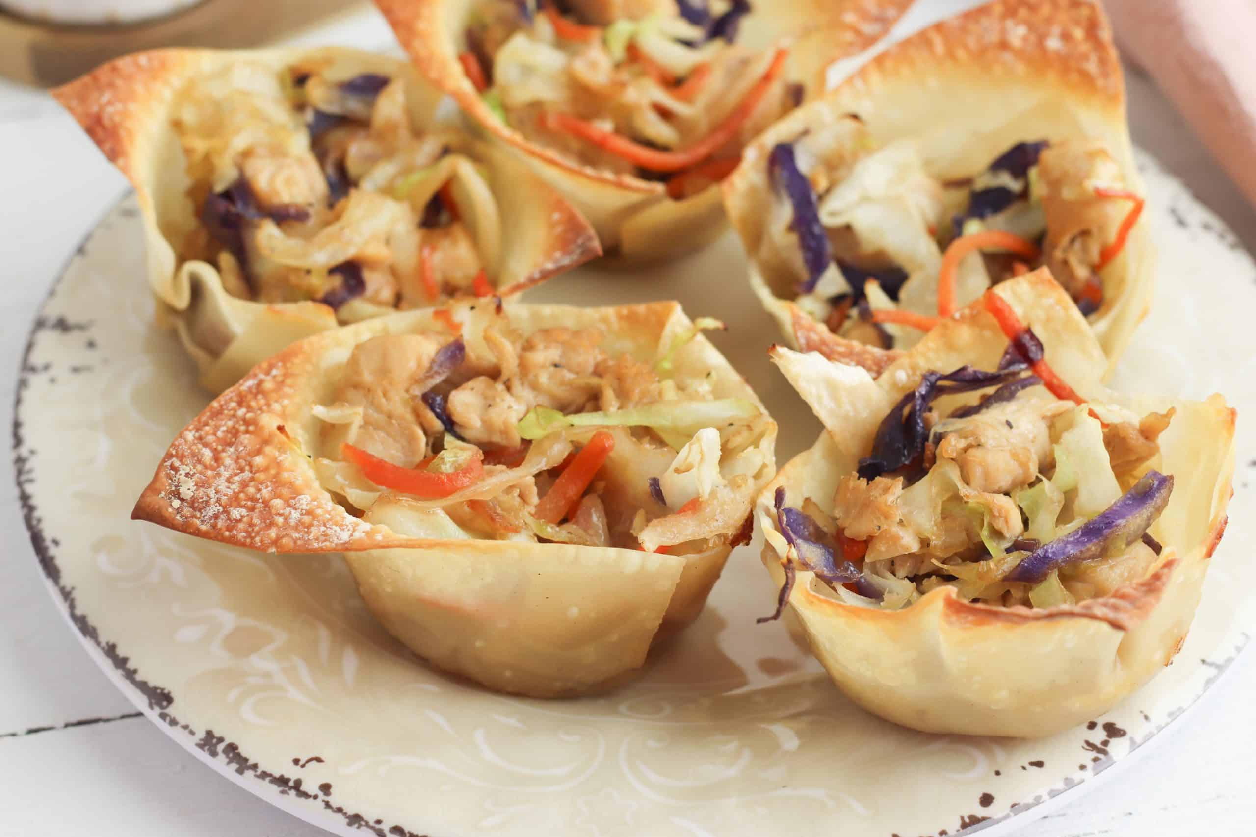 Egg roll cups on a plate.