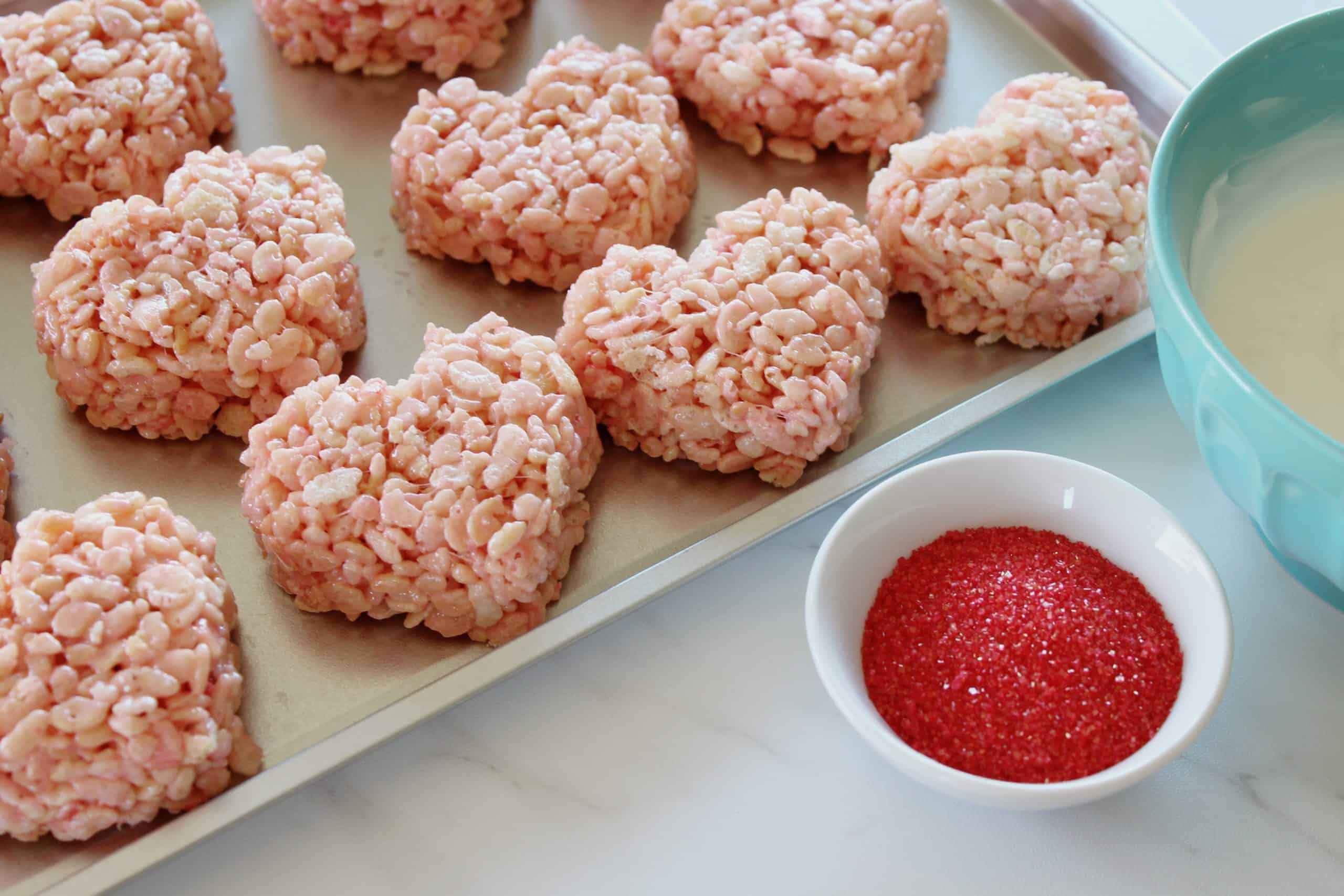 Pink Valentine Rice Krispie Treats on a sheet pan.
