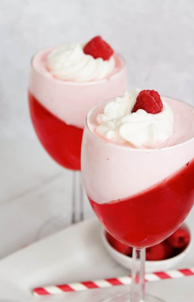 Valentine's Day Jello with whipped cream & raspberries.