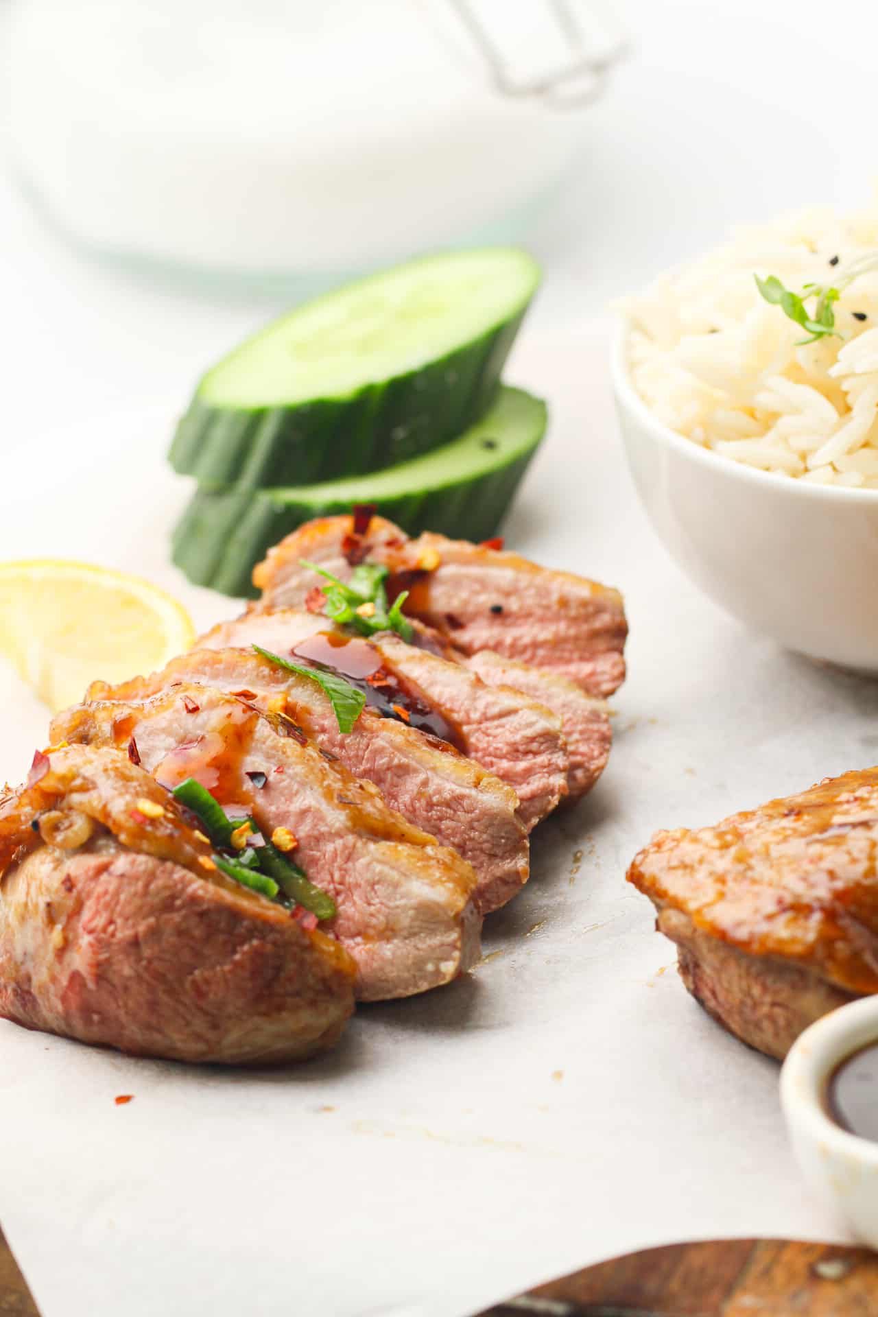 Sliced duck breast on a cutting board.