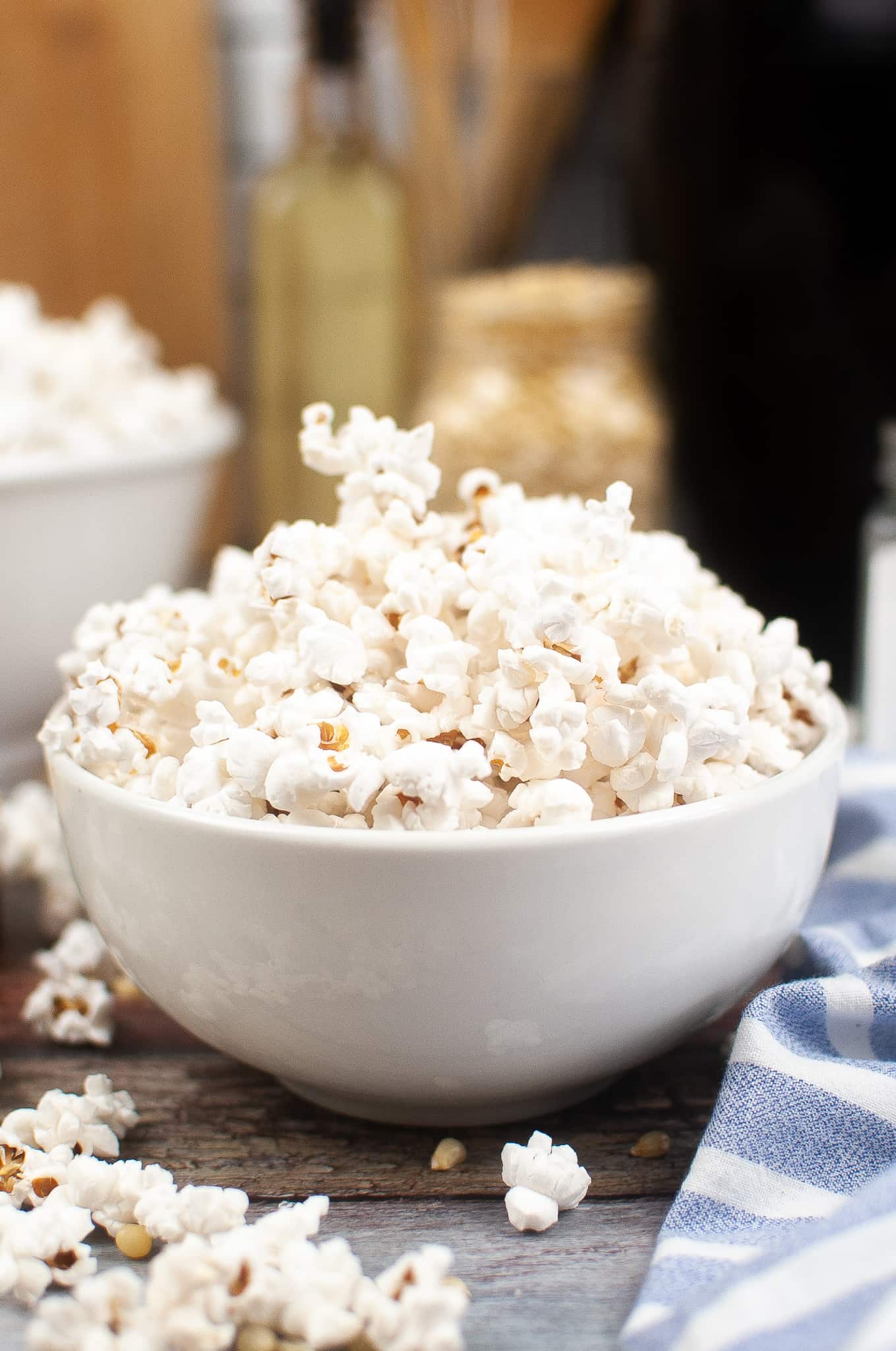 Head on view of air fryer popcorn in a white bowl.