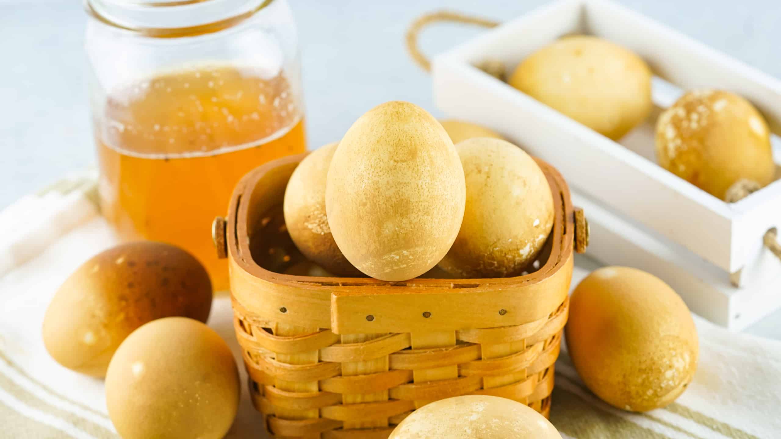Black tea dyed Easter eggs in a basket.