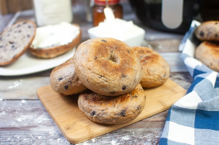 Bagels on a cutting board.