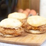 3 Copycat Chick-fil-a sandwiches on a cutting board.