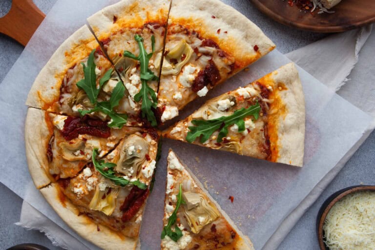 Overhead view of pizza with a slice out of it.