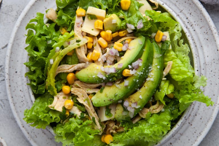 Ovehead view of Grilled Chicken Salad with Cilantro Dressing.