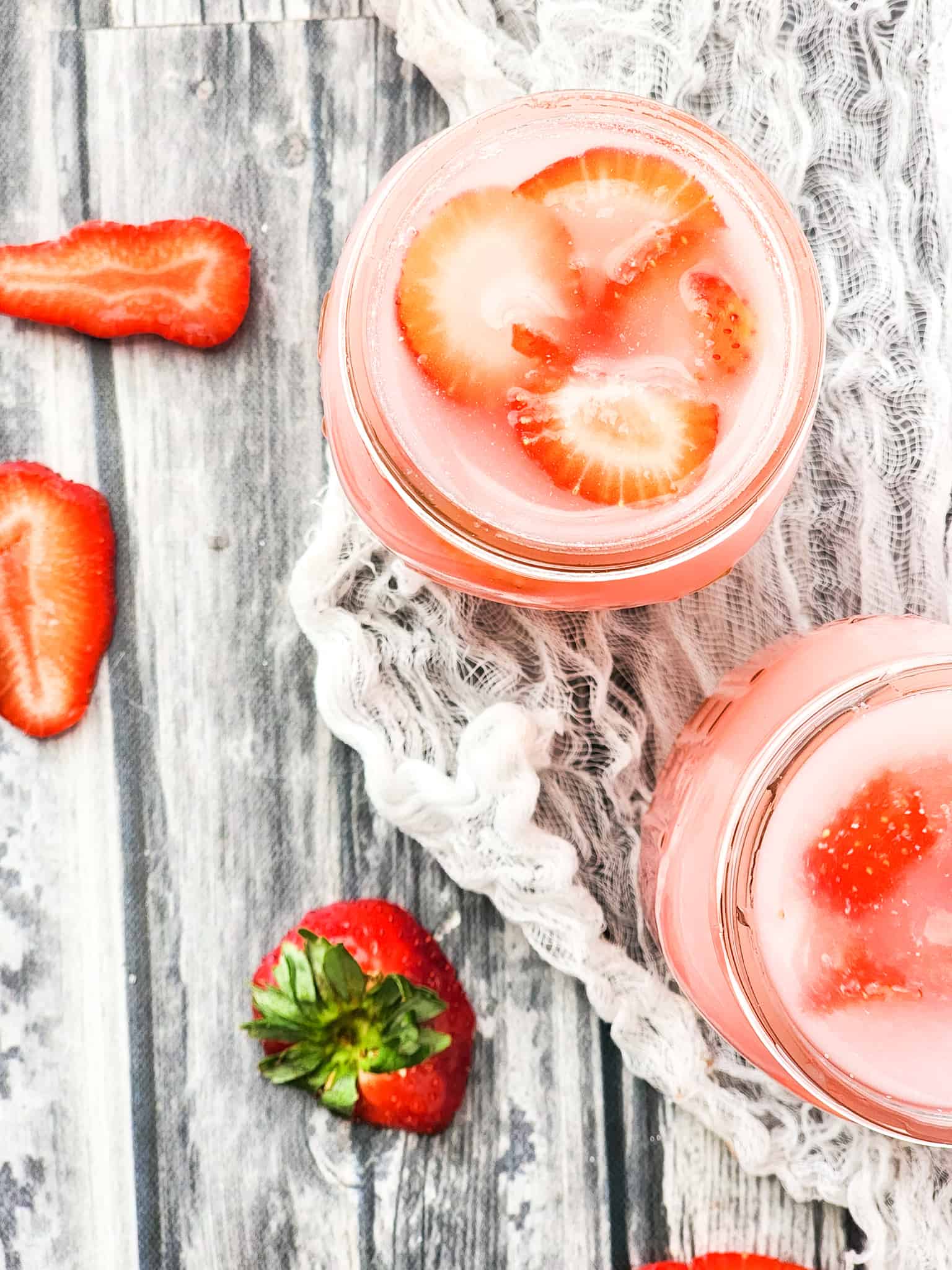 Overhead view of Starbucks Pink Drinks Copycat Recipes in Mason Jars.