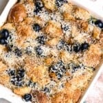 Overhead view of breakfast casserole with blueberries & coconut.