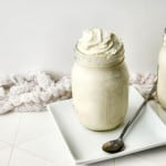 Vanilla Bean Frappuccino on a white plate with a silver spoon.