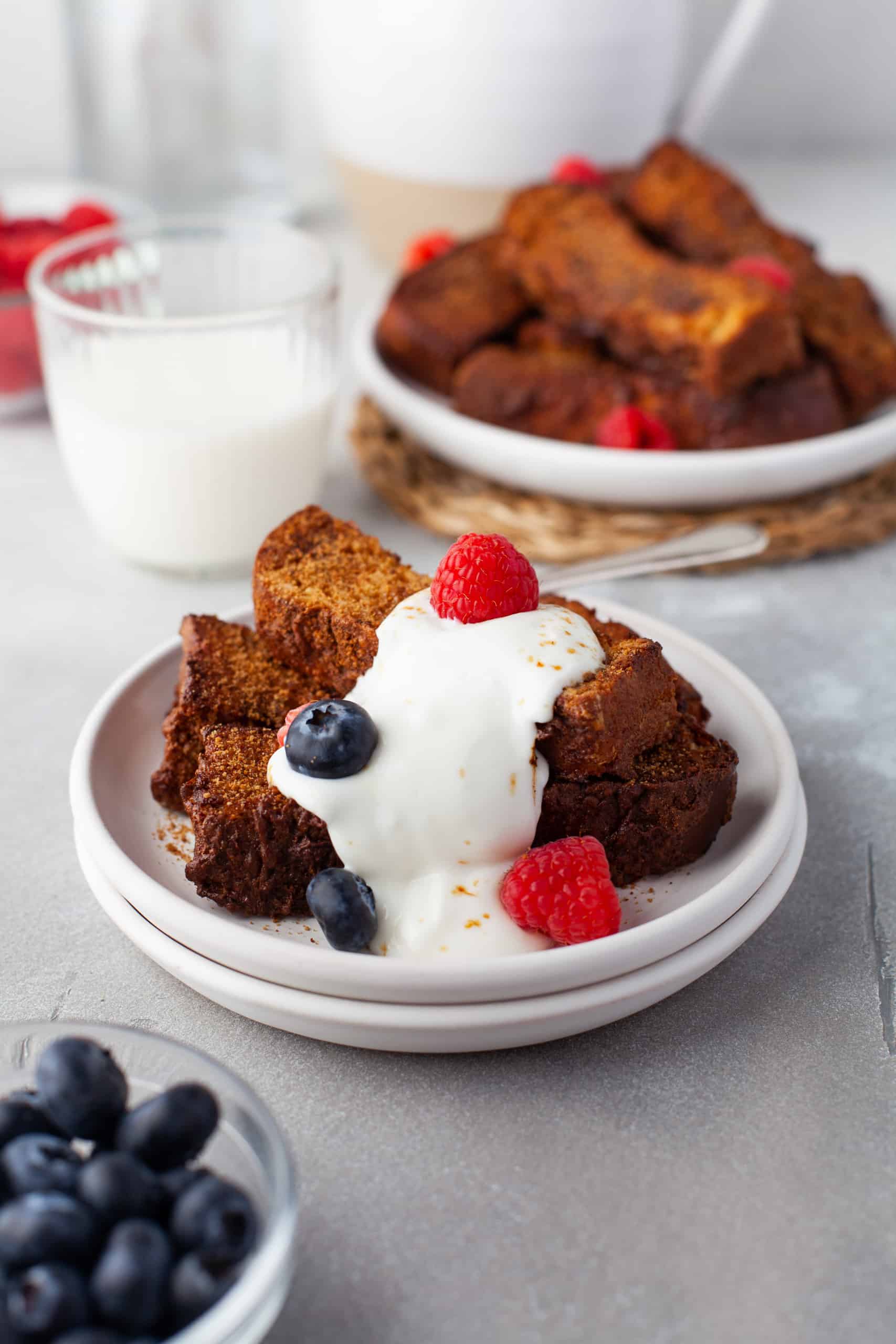 Air Fryer French Toast Sticks with fresh cream and berries.
