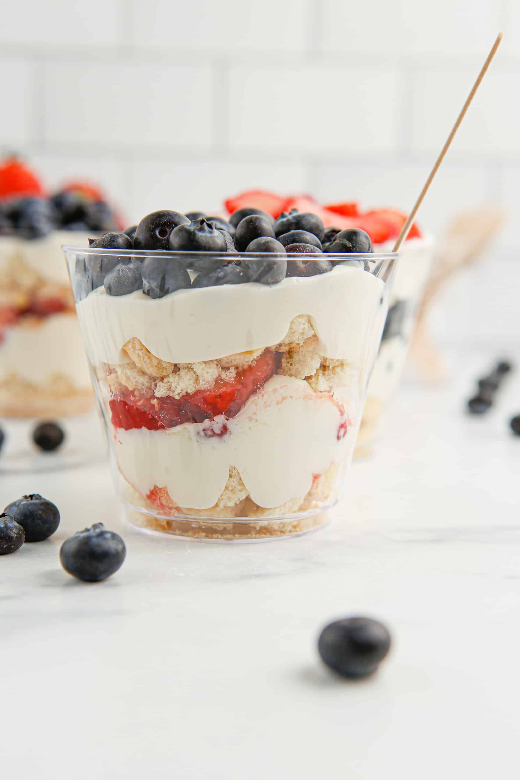 Mini trifle with blueberries on top.
