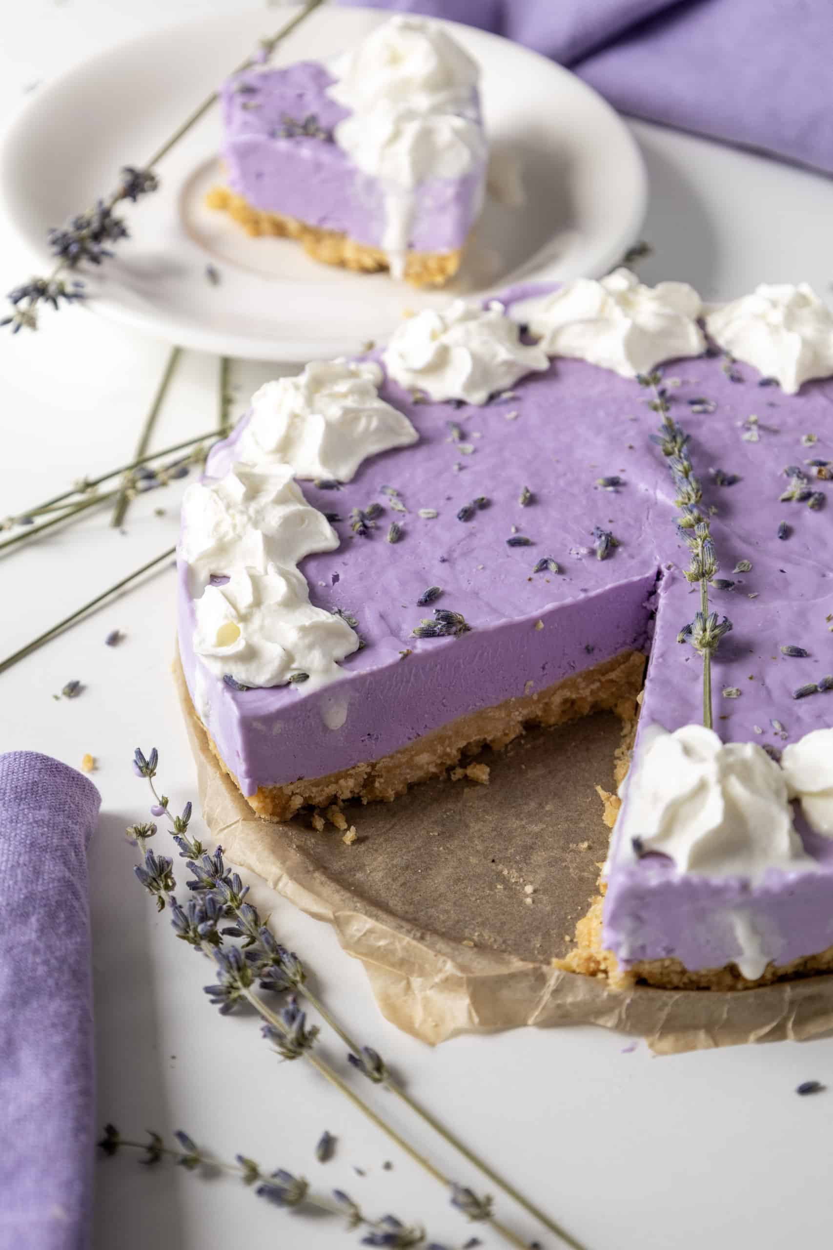 Lavender Cheesecake with a slice removed.