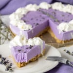 Lavender Cheesecake with a slice out of it.