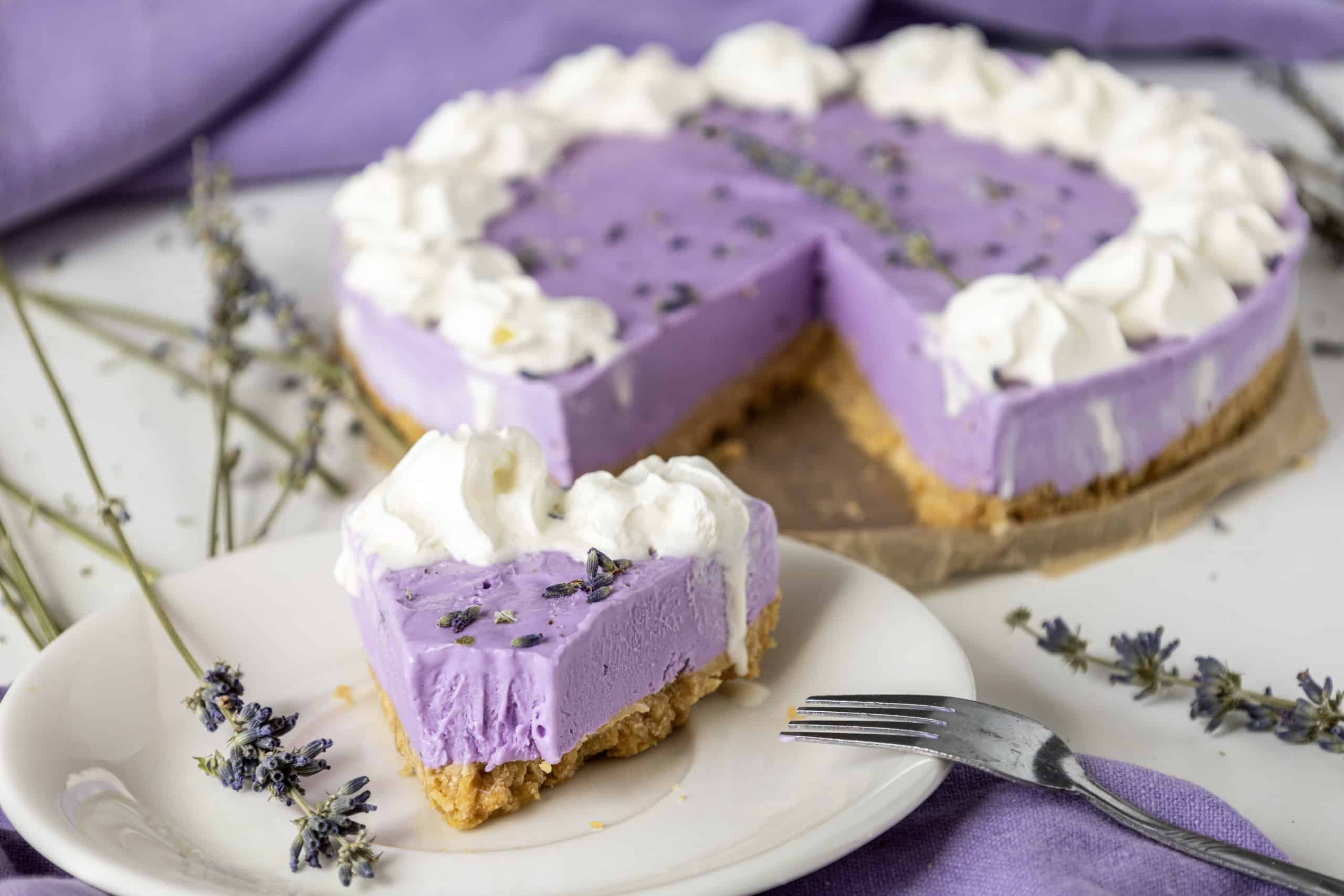 Lavender Cheesecake with a slice out of it.