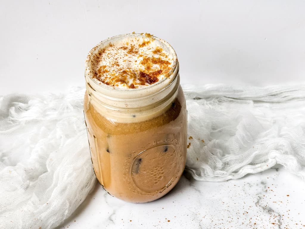 Starbucks brown sugar shaken espresso in a glade mason jar.