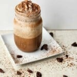 Tiramisu Frappuccino in a Mason jar on a white plate.