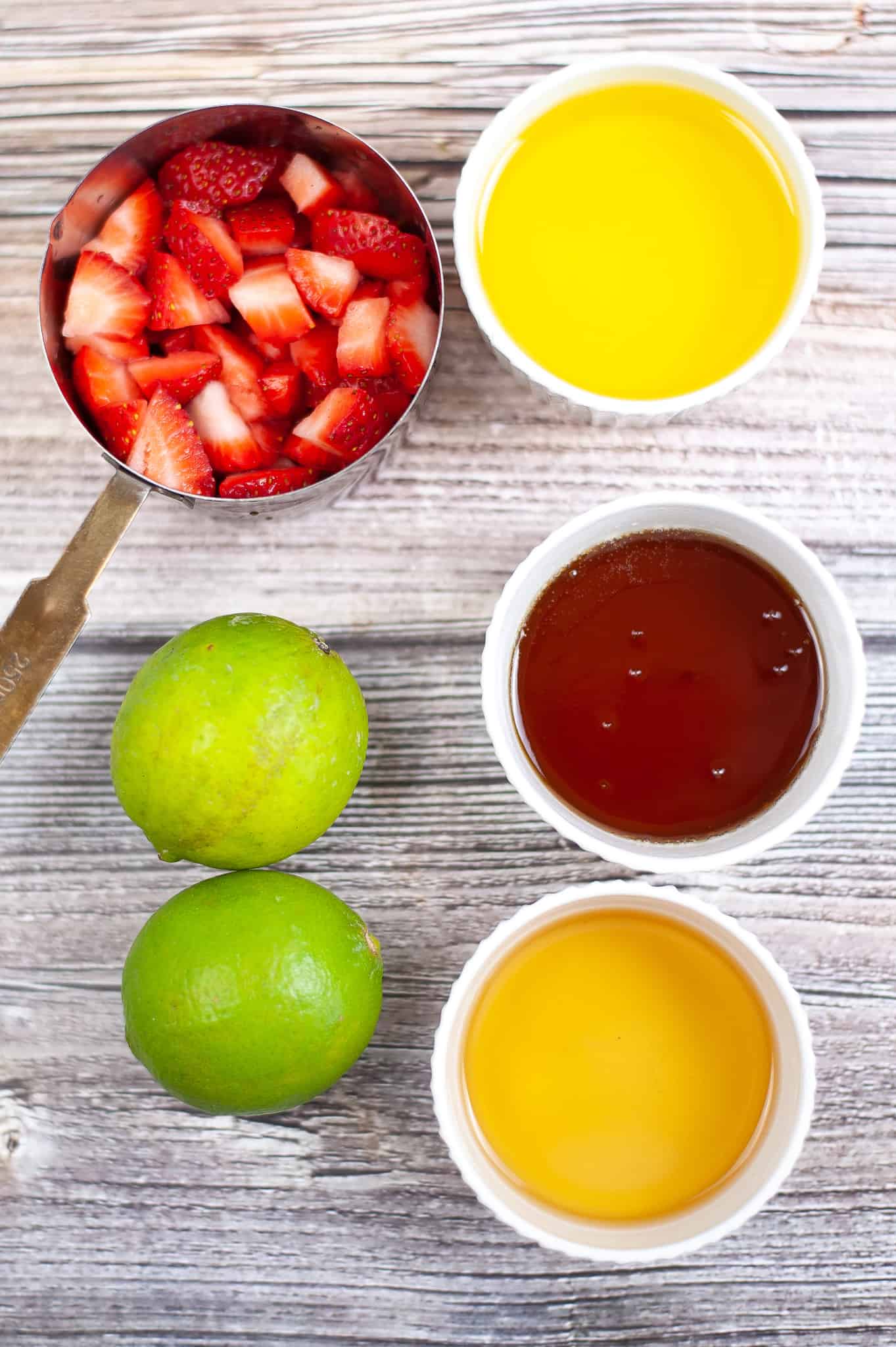 Overhead view of ingredients of strawberry vinaigrette.
