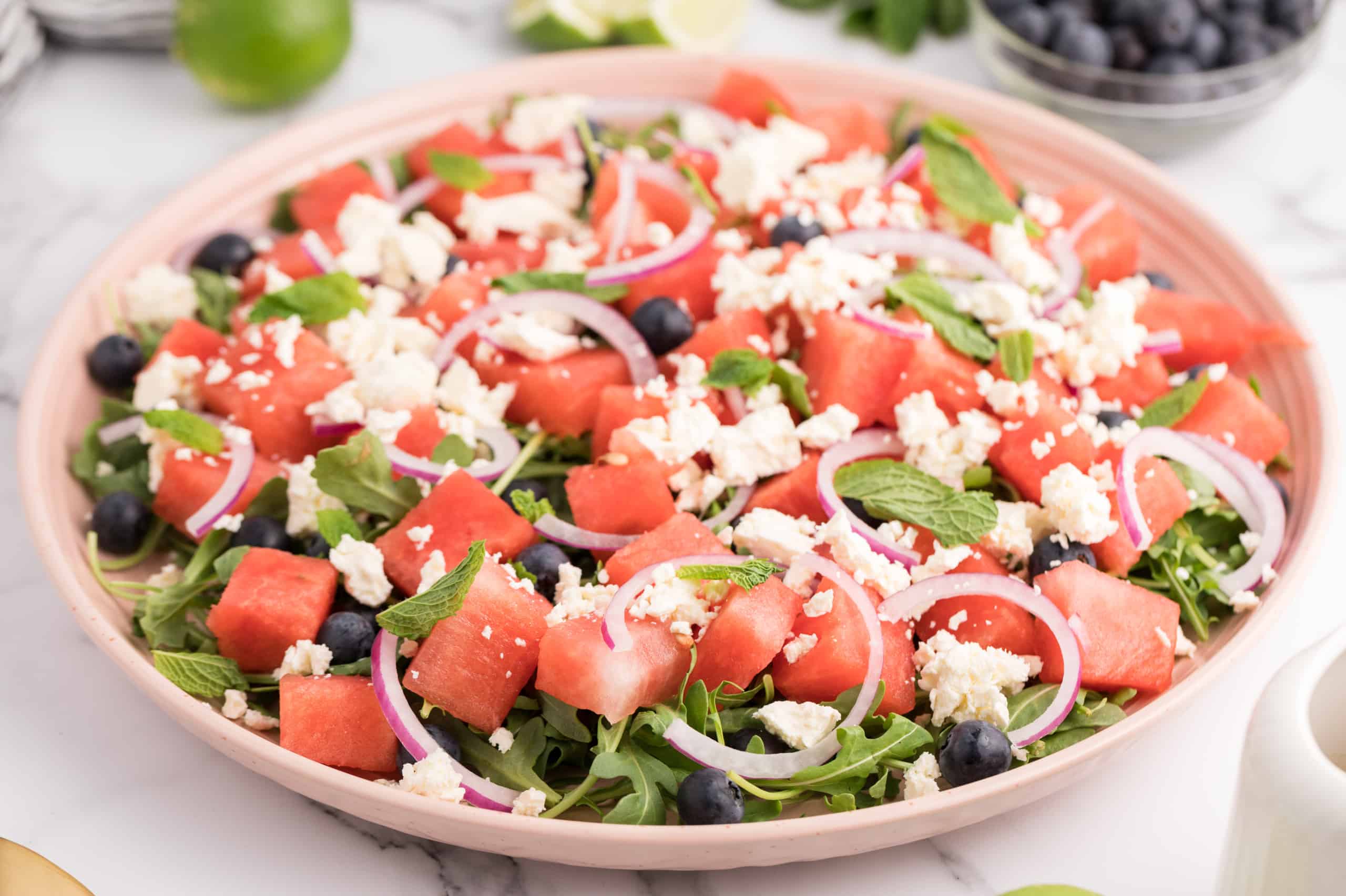 Watermelon Blueberry and FEta Salad with red onions and lime vinaigrette.