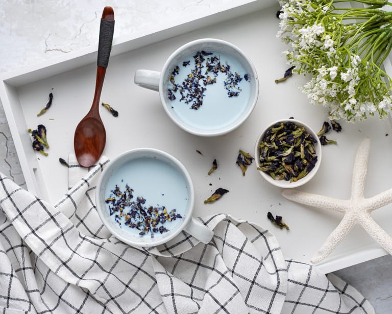 Overhead view of 2 cups of Blue Moon Milk with Sensoril Ashwagandha Supplement.
