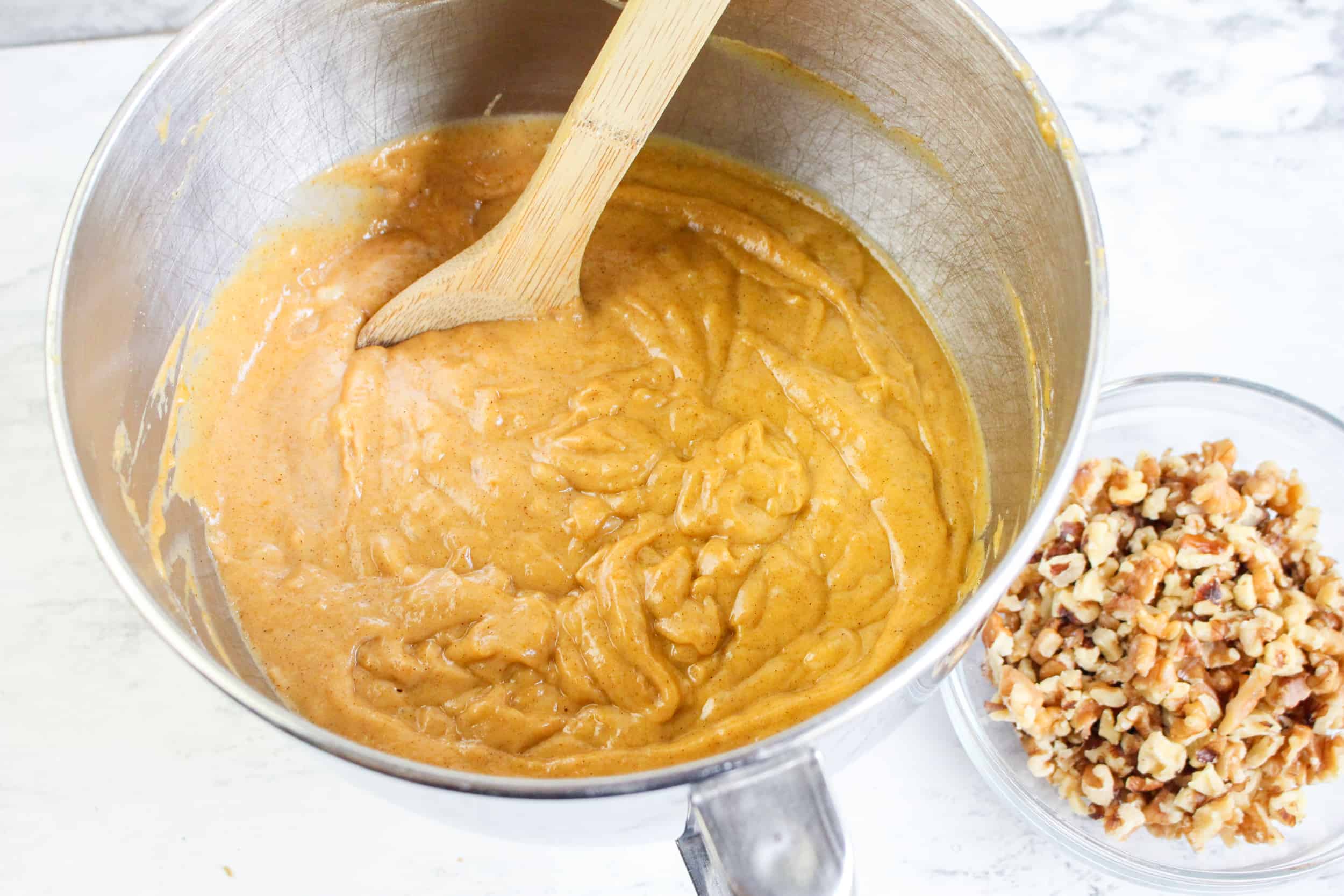 Overhead view of pumpkin banana bread in mixing bowl.