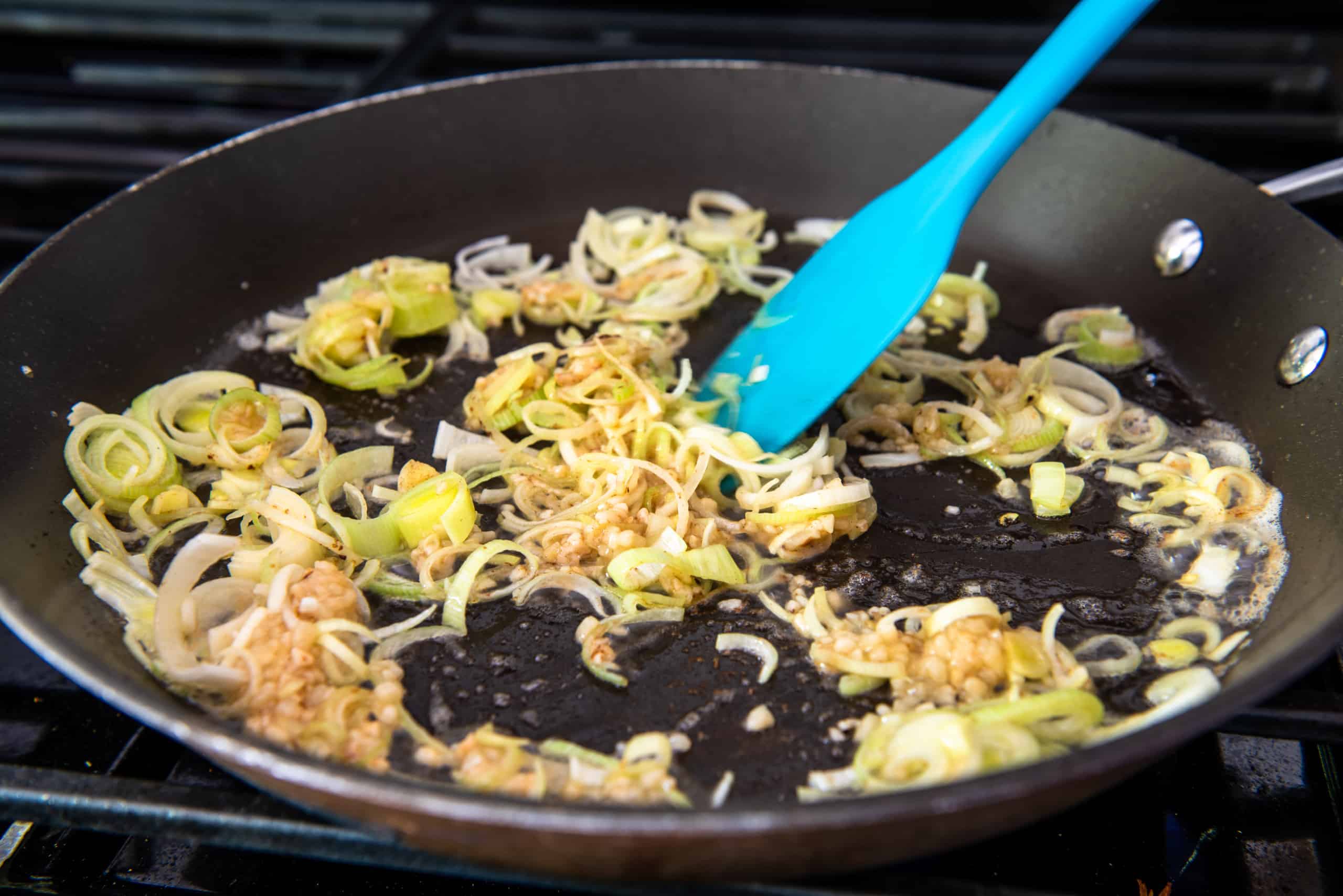 Sauteeing vegetables in a skillet.