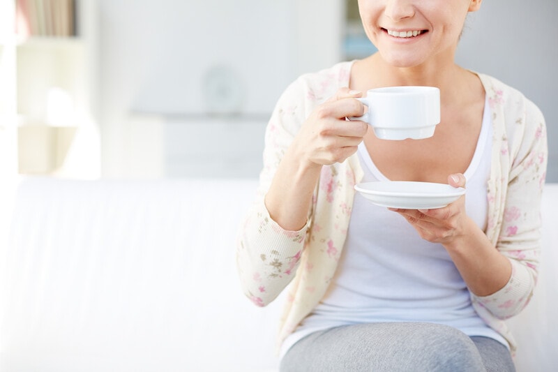 Aging woman drinking tea.