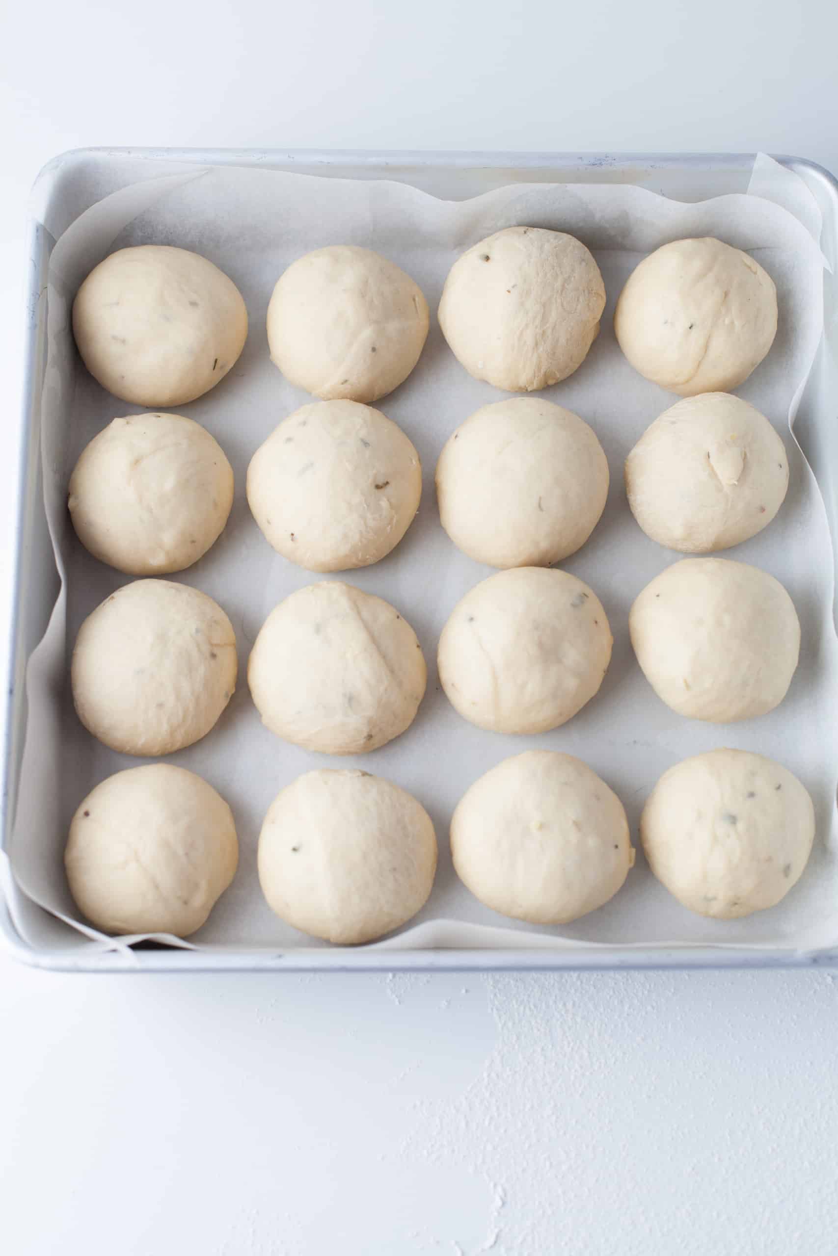 Forming garlic roll dough balls.