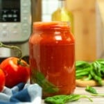 Headon view of tomato sauce in a jar.