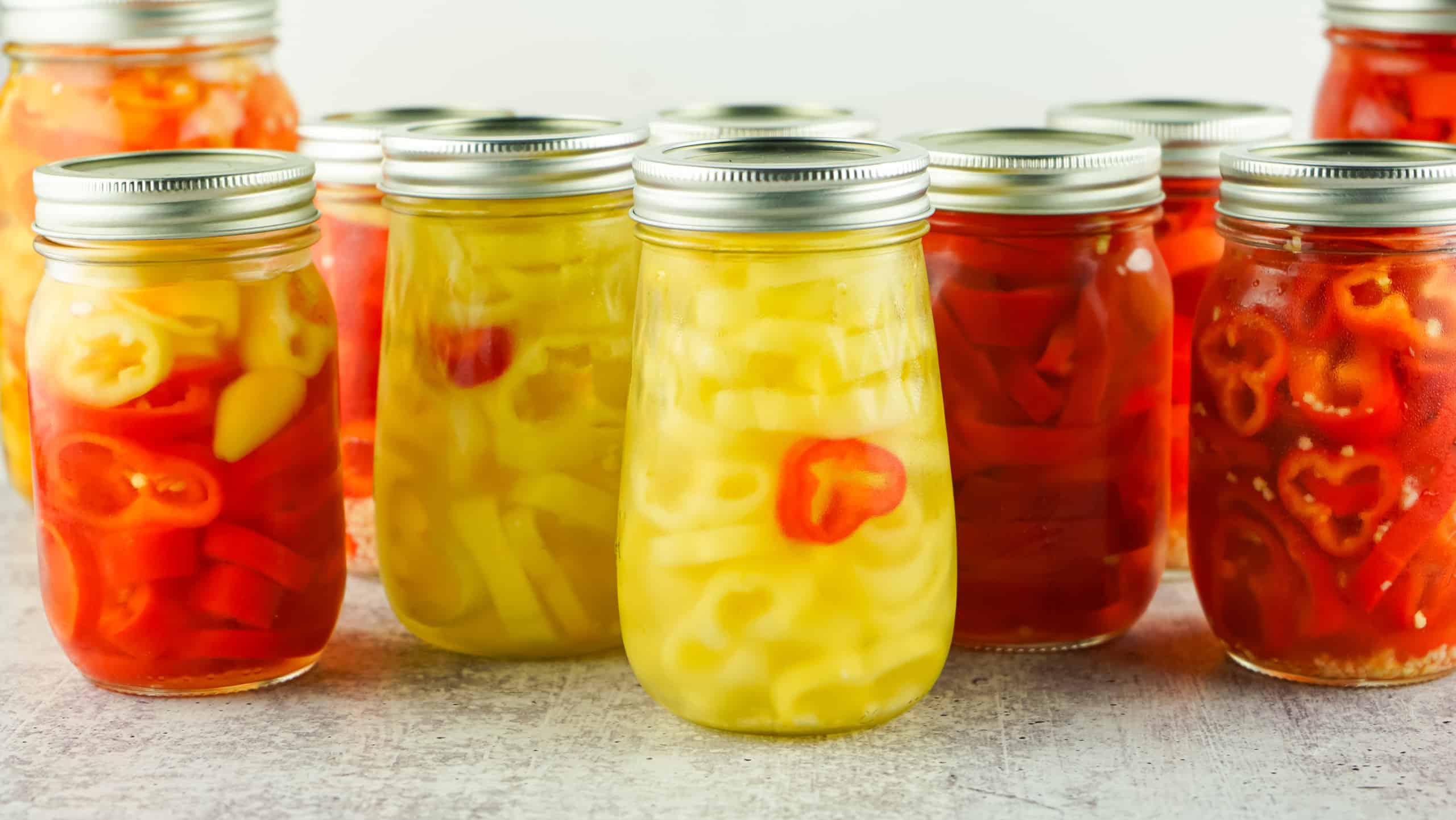 Jars of pickled banana peppers.