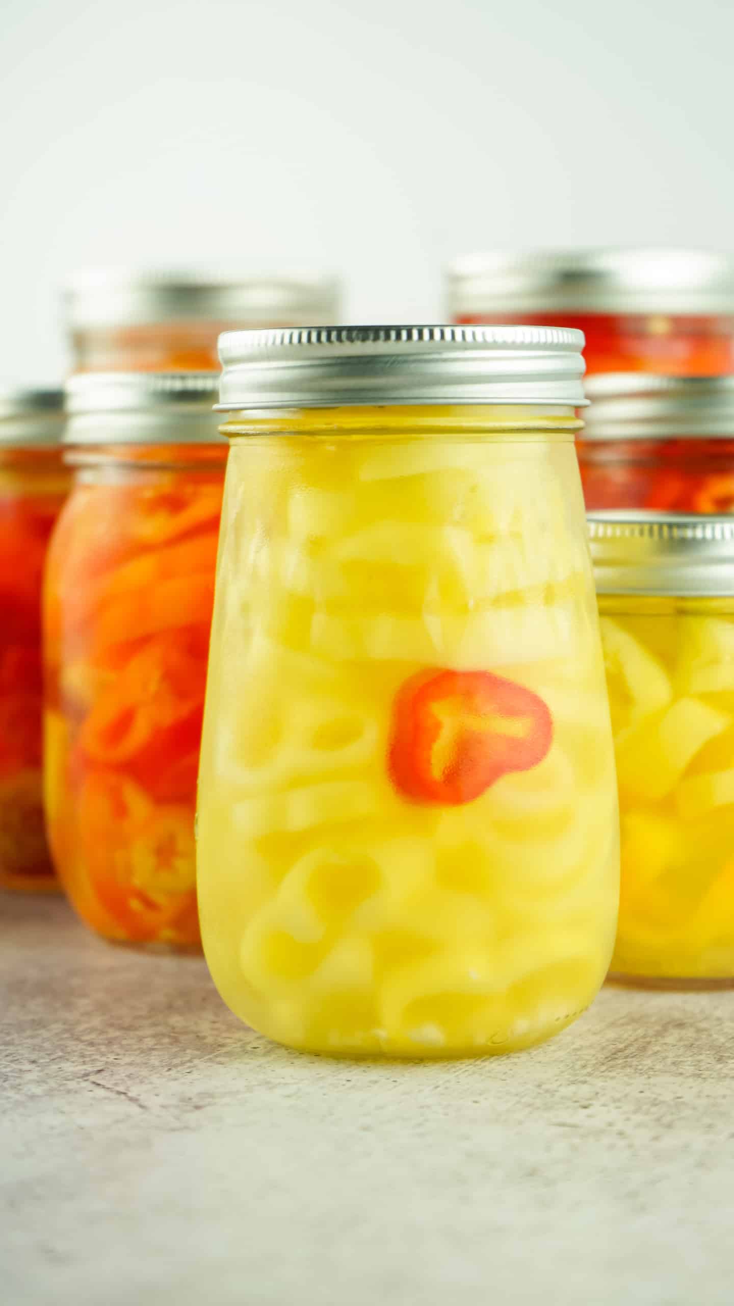 Jars of pickled banana peppers.