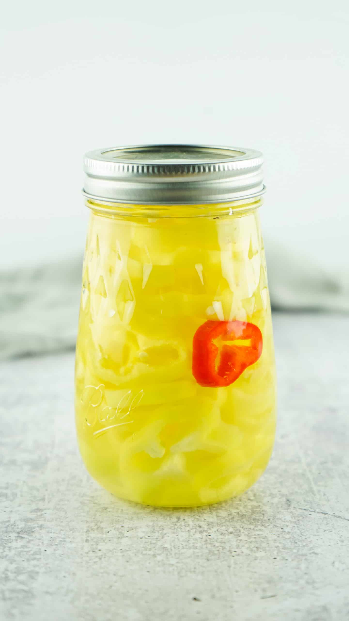 Jar of pickled banana peppers.