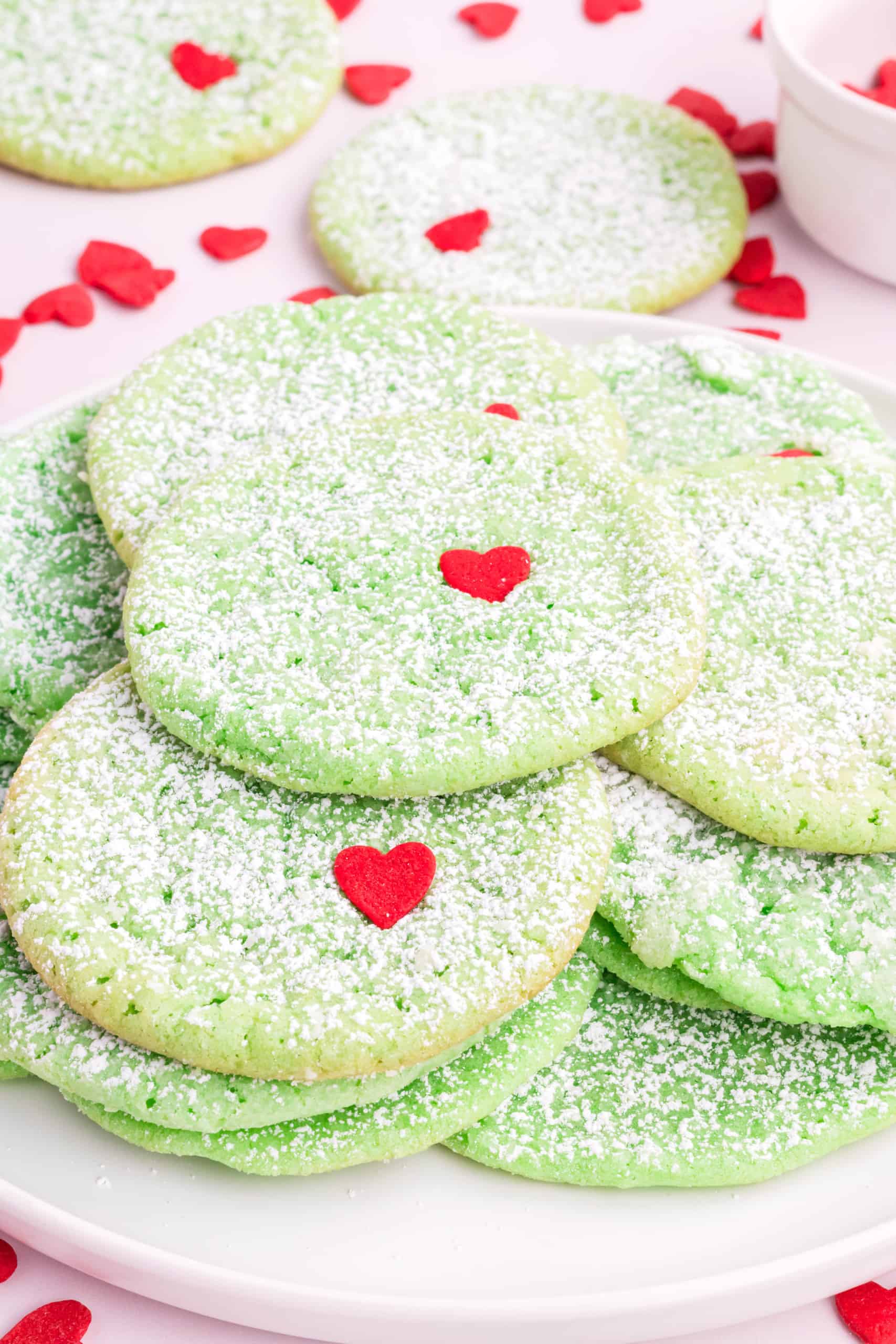 Closeup view of stacked Grinch cookies.