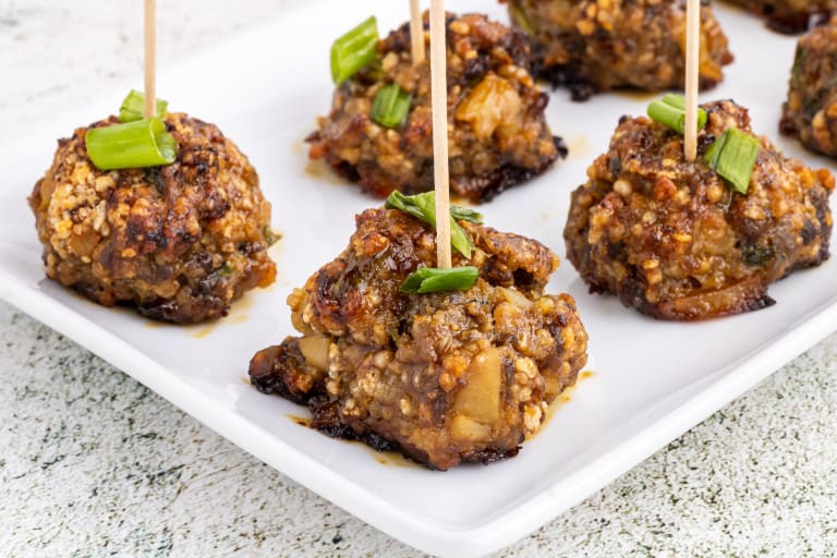 Close-up of meatball appetizers made with Hoisin sauce.