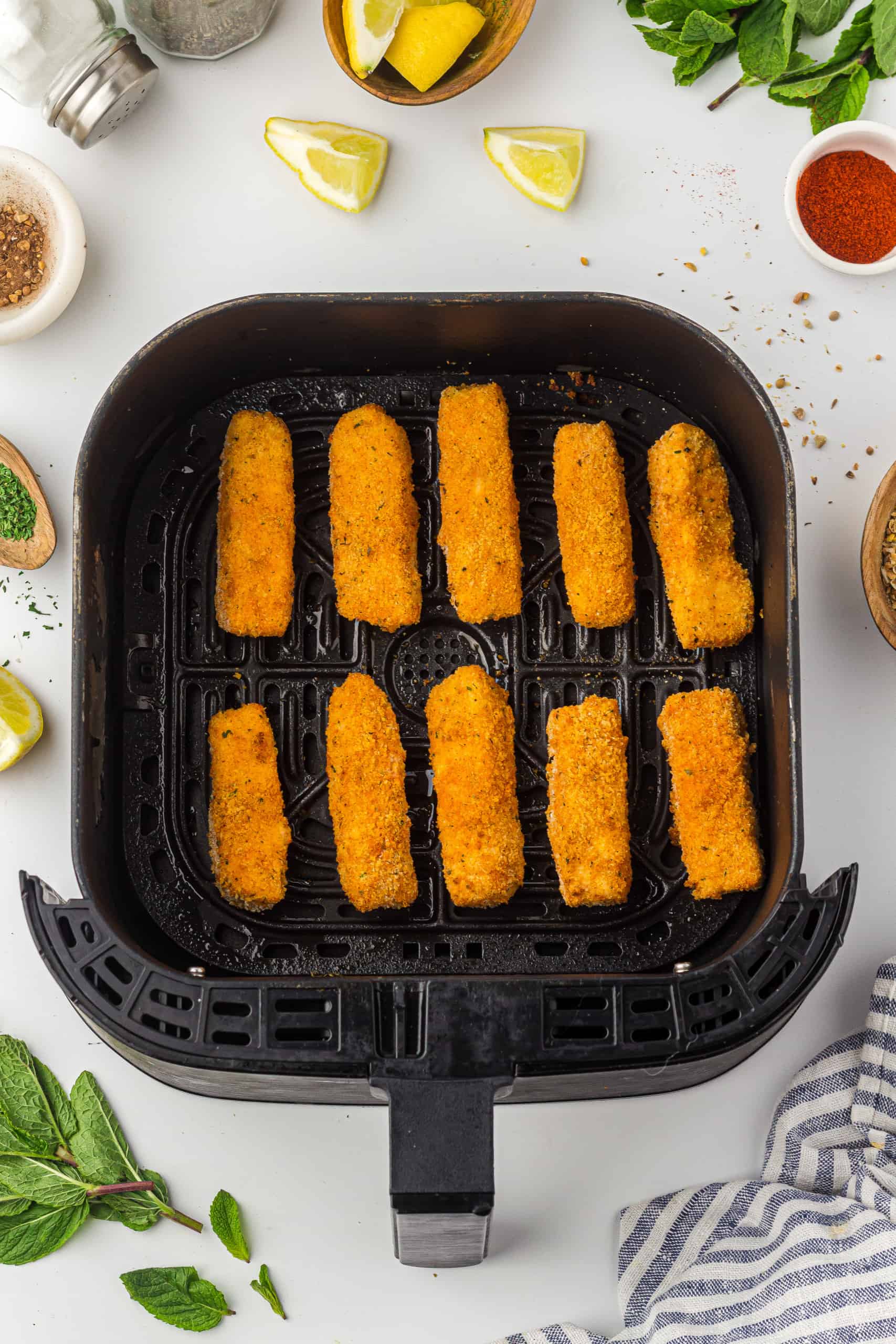 Overhead view of breaded Halloumi cheese sticks.